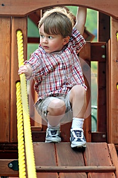 Boy on Playground Equipment