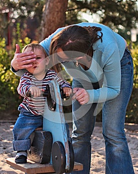 Boy on Playground with Mother