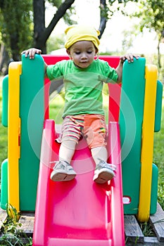 Boy on playground slide