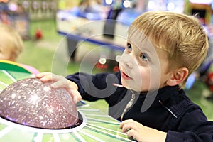 Boy playing arcade game