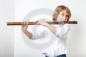 Boy playing bamboo flute