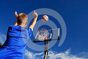 Boy playing basketball photo