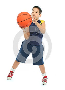 Boy playing basketball isolated