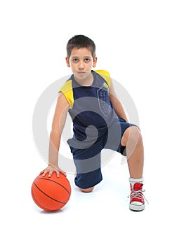Boy playing basketball isolated