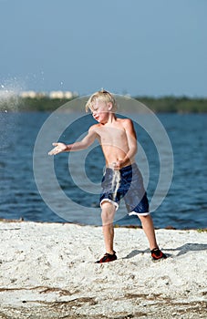 Boy playing on beach