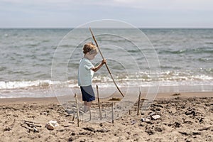 Boy playing at the beach