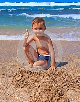 Boy playing on the beach