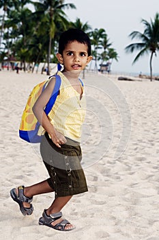Boy playing at the beach