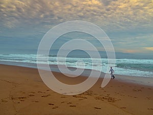 Boy playing on the beach