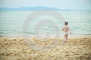 Boy playing on the beach