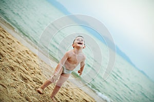 boy playing on the beach