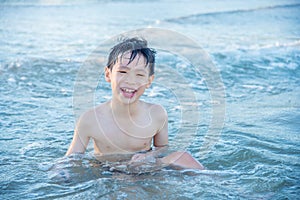 Boy playing on the beach