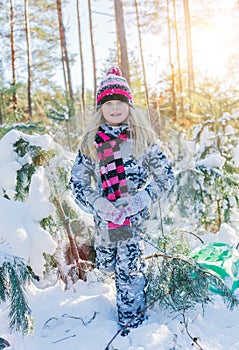 Boy playing in big snow in winter.