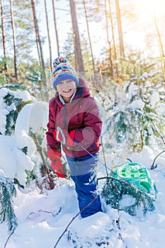 Boy playing in big snow in winter.