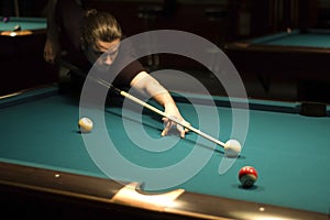 Boy playing billiard photo