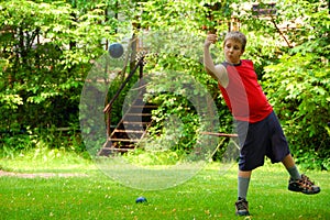 Boy Playing Bocce Ball photo