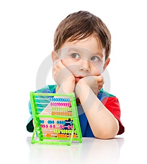 Boy is playing with building blocks