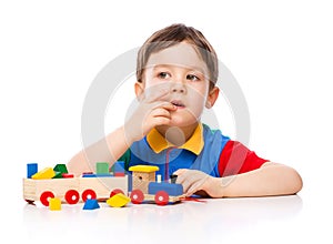 Boy is playing with building blocks