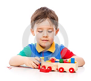 Boy is playing with building blocks