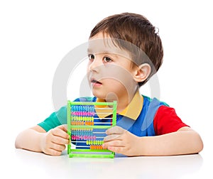 Boy is playing with building blocks