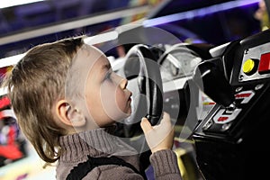 Boy playing with car simulator