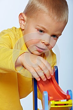 Boy playing with cars