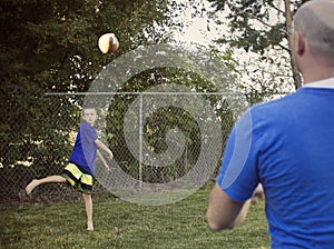 Boy Playing Catch with Dad