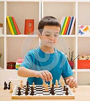 Boy playing chess