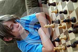 Boy playing chess