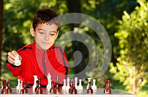 Boy playing chess game