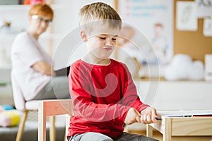 Boy playing in classrom