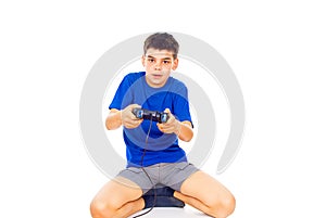 Boy playing computer games on the joystick