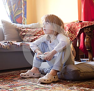 Boy Playing Console Game