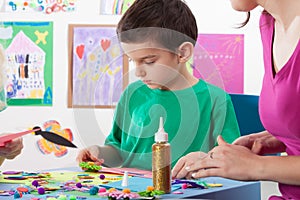 A boy playing creative colourful games
