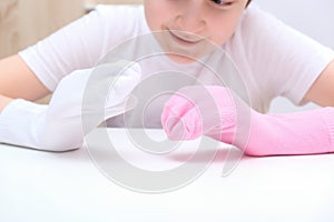 A boy playing creative handmade hand puppets made of socks, home theatre performance