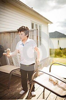 Boy playing cup and ball