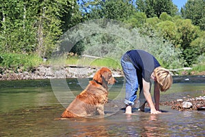 Boy playing with dog