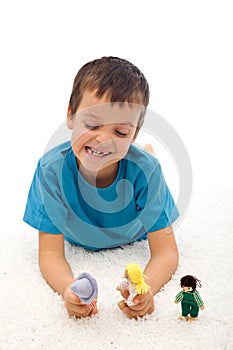 Boy playing domestic violence game with puppets