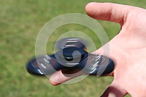 Boy playing with fidget spinner toy