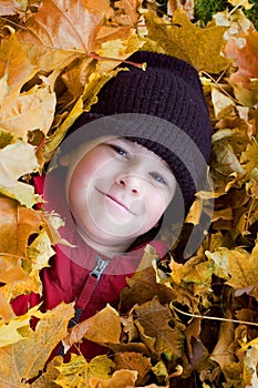 Boy playing in the foliage