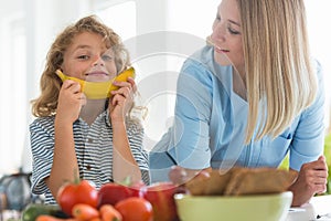 Boy playing with fruit during a visit to a dietitian