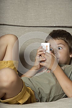 Boy Playing Game on Cell Phone