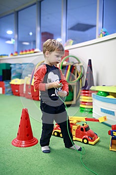 Boy playing in game room