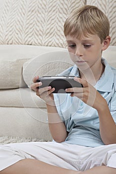 Boy Playing Games On PSP