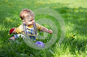 A boy playing on the grass