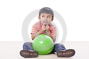 boy playing green ball