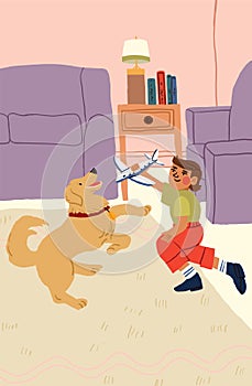 The boy playing with his dog in the living room. Happy family time. Golden retriever and the child.