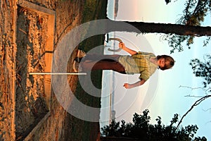 Boy playing horseshoes