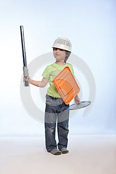 Boy playing knight using cookware