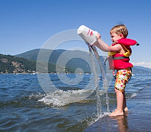 Boy playing at lake